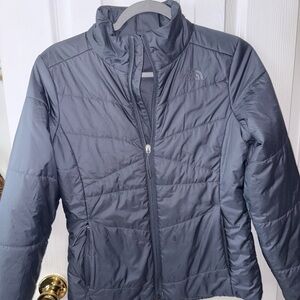 The North Face woman’s small blue jacket